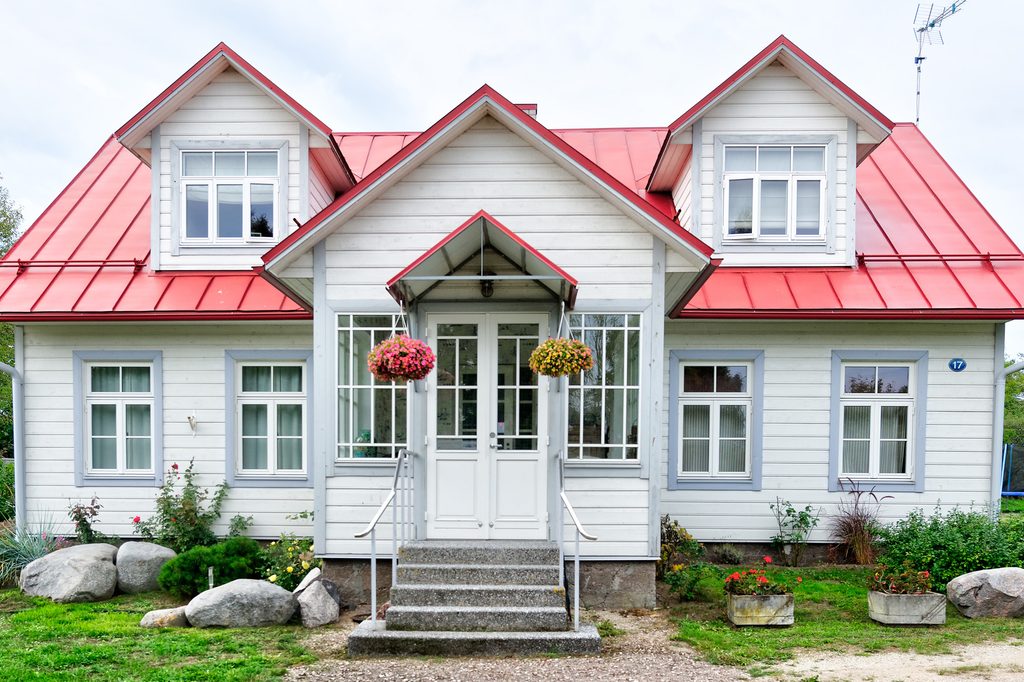White Cape Cod-style house with a red roof