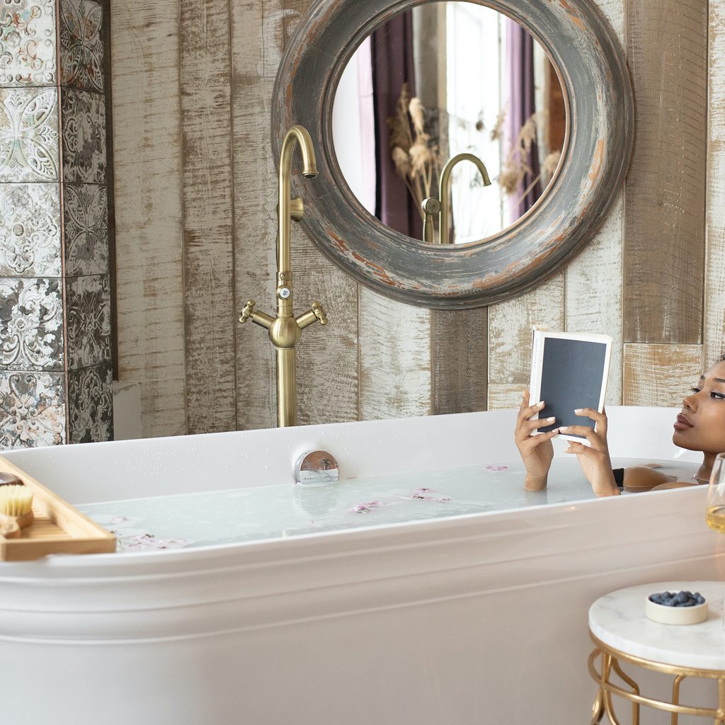 Woman relaxing in bathtub