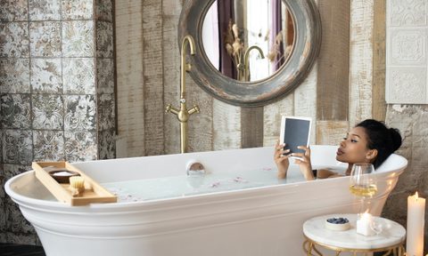 Woman relaxing in bathtub