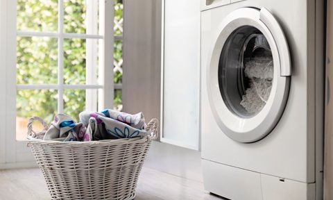 Close-up of a laundry basket and washing machine