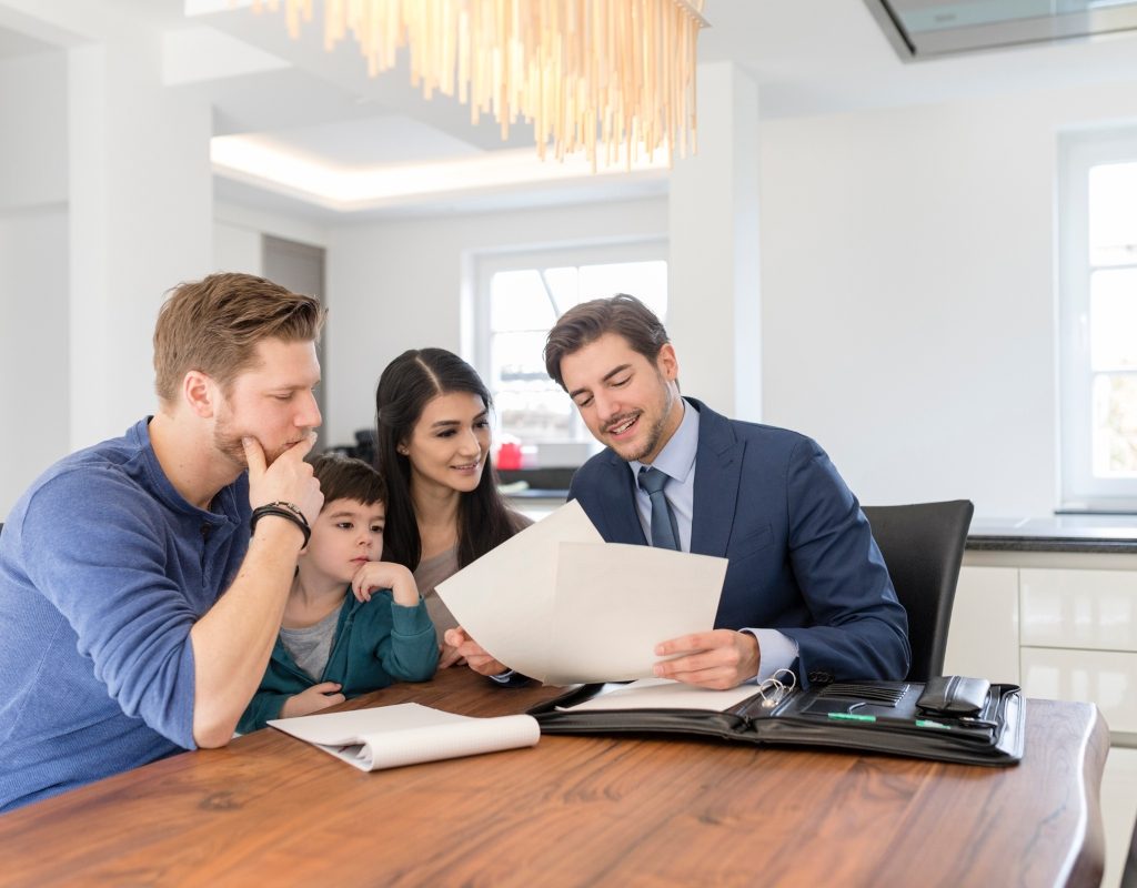 family talking to a realtor about buying a home