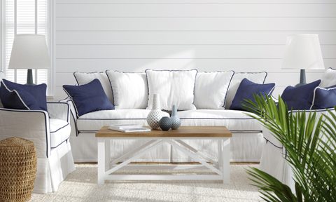 modern coastal living room with blue and white wicker
