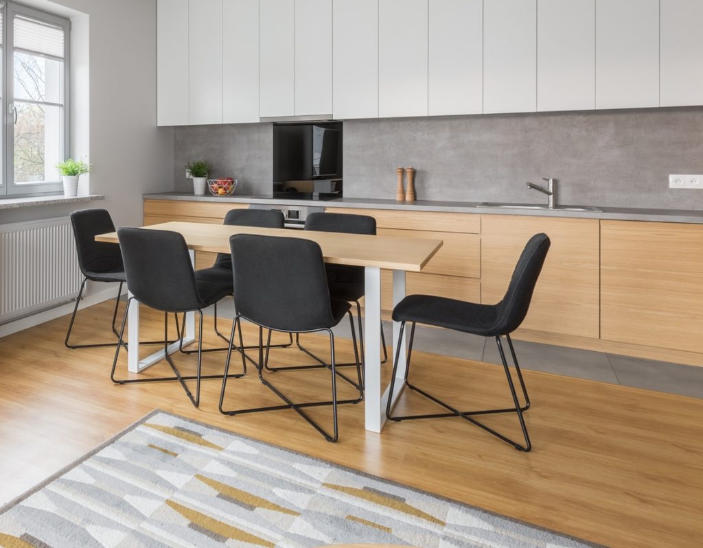 oak wood flooring and cabinets in modern kitchen