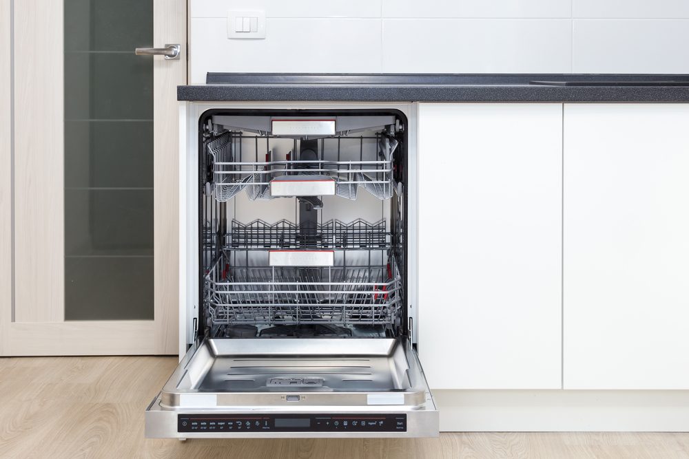 Front view of open dishwasher in a modern kitchen