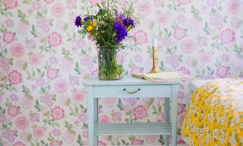 flower patterned wallpaper with flower vase on nightstand