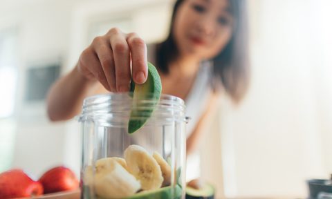 easy smoothie recipes with three ingredients young woman making healthy for breakfast