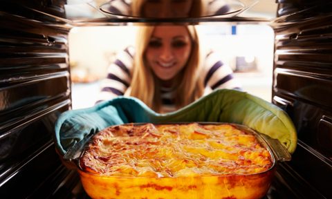 easy lasagna recipes woman removing oven