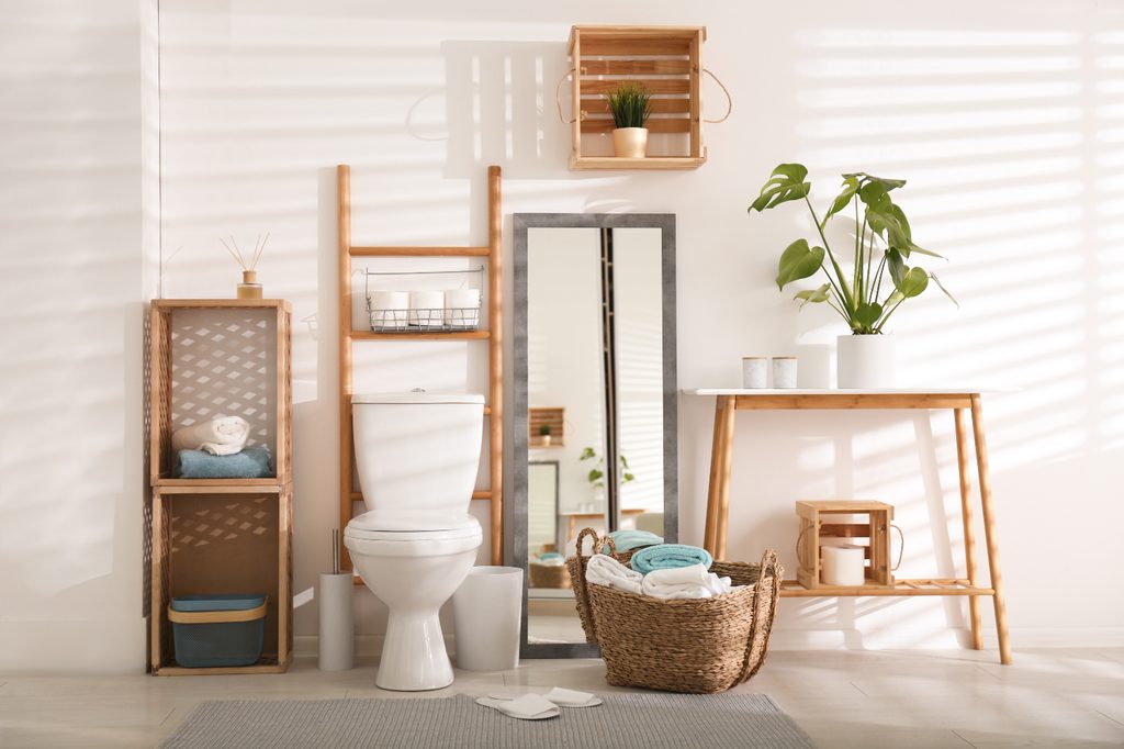 Bathroom toilet area with warm brown hues