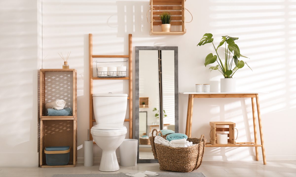 Bathroom toilet area with warm brown hues