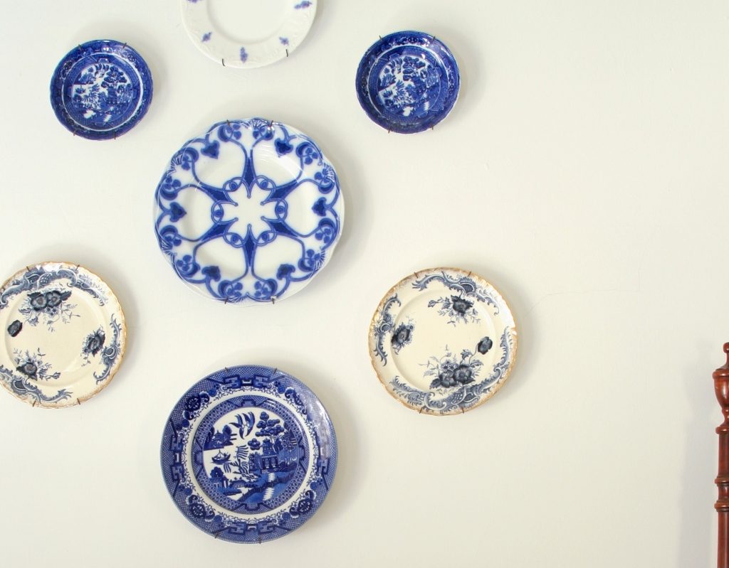 blue and white porcelain plates hung as wall art