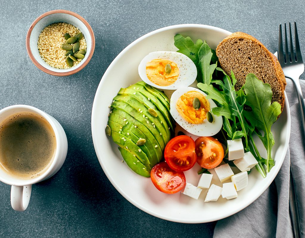 Healthy breakfast plate with coffee
