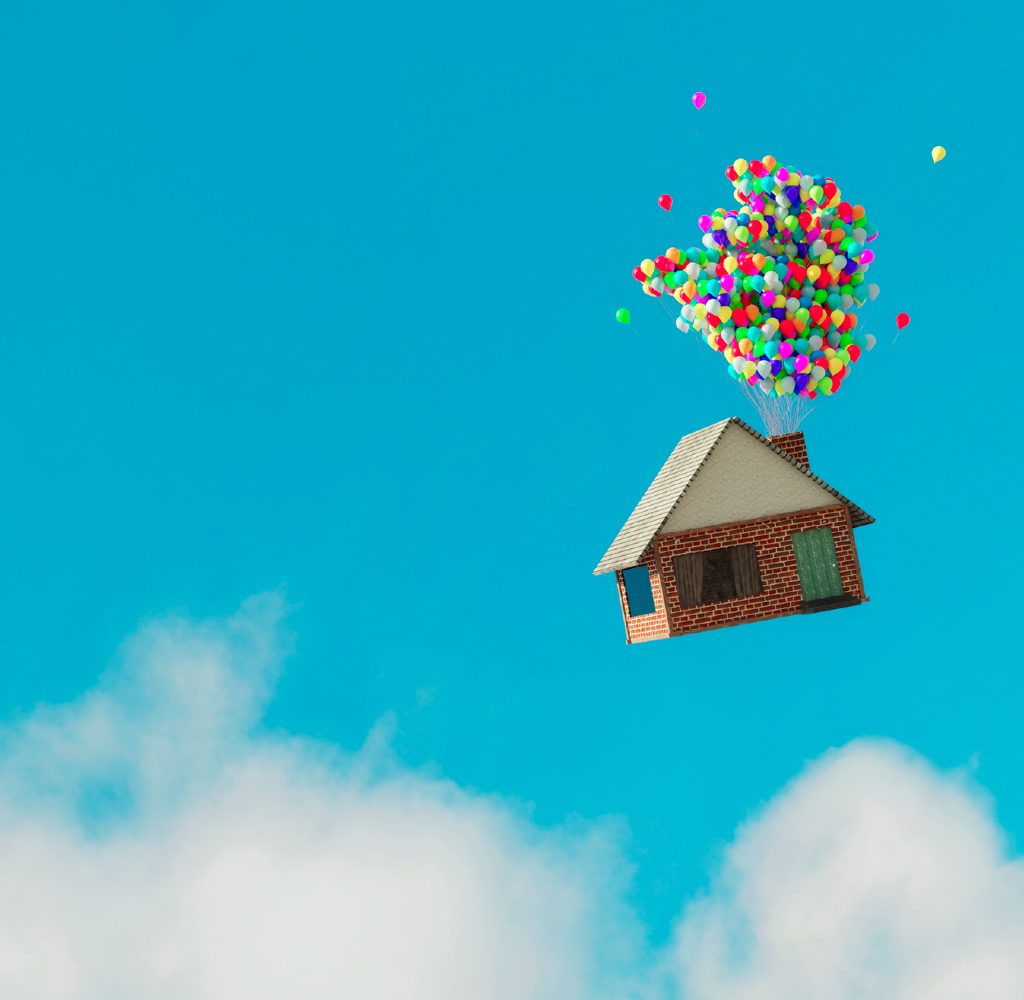 House being carried away by a bunch of balloons.