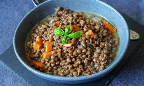Lentil dish in blue bowl.