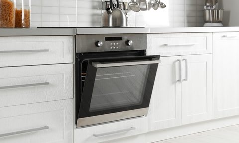 Open oven door on silver stove