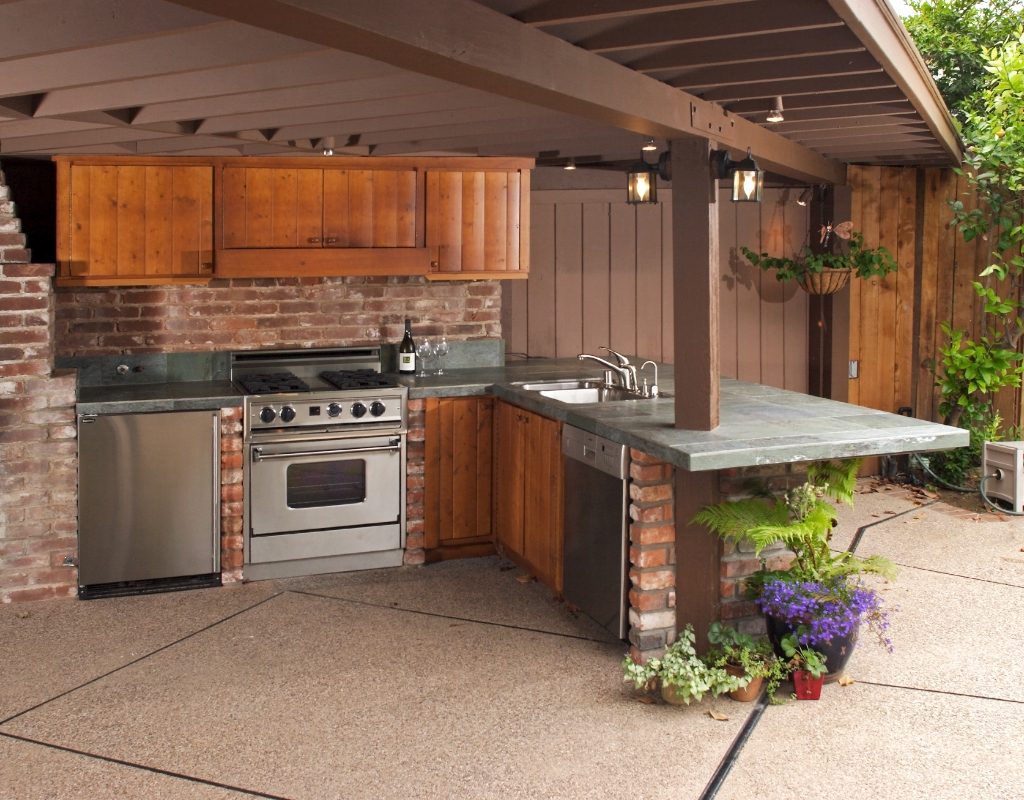 outdoor patio space with kitchen area