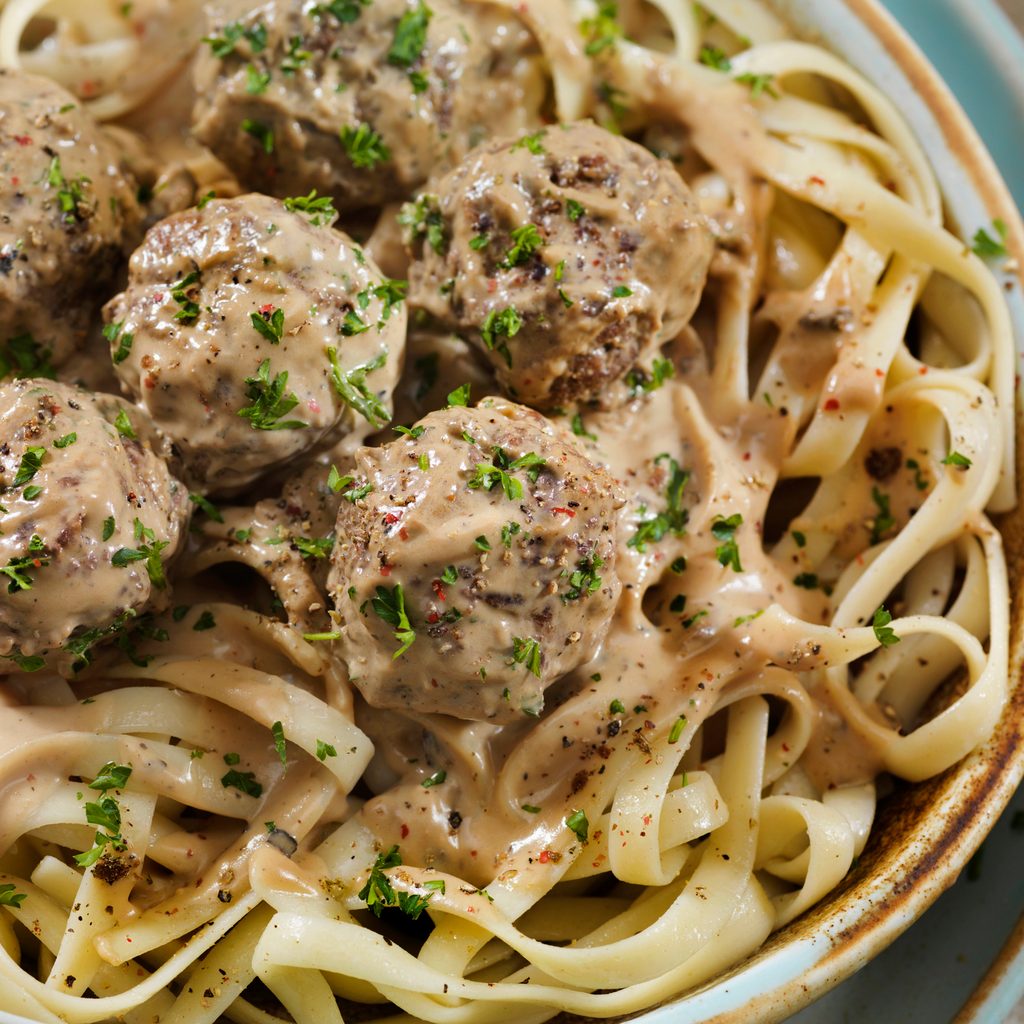 Swedish meatballs on linguini noodles with parsley garnish