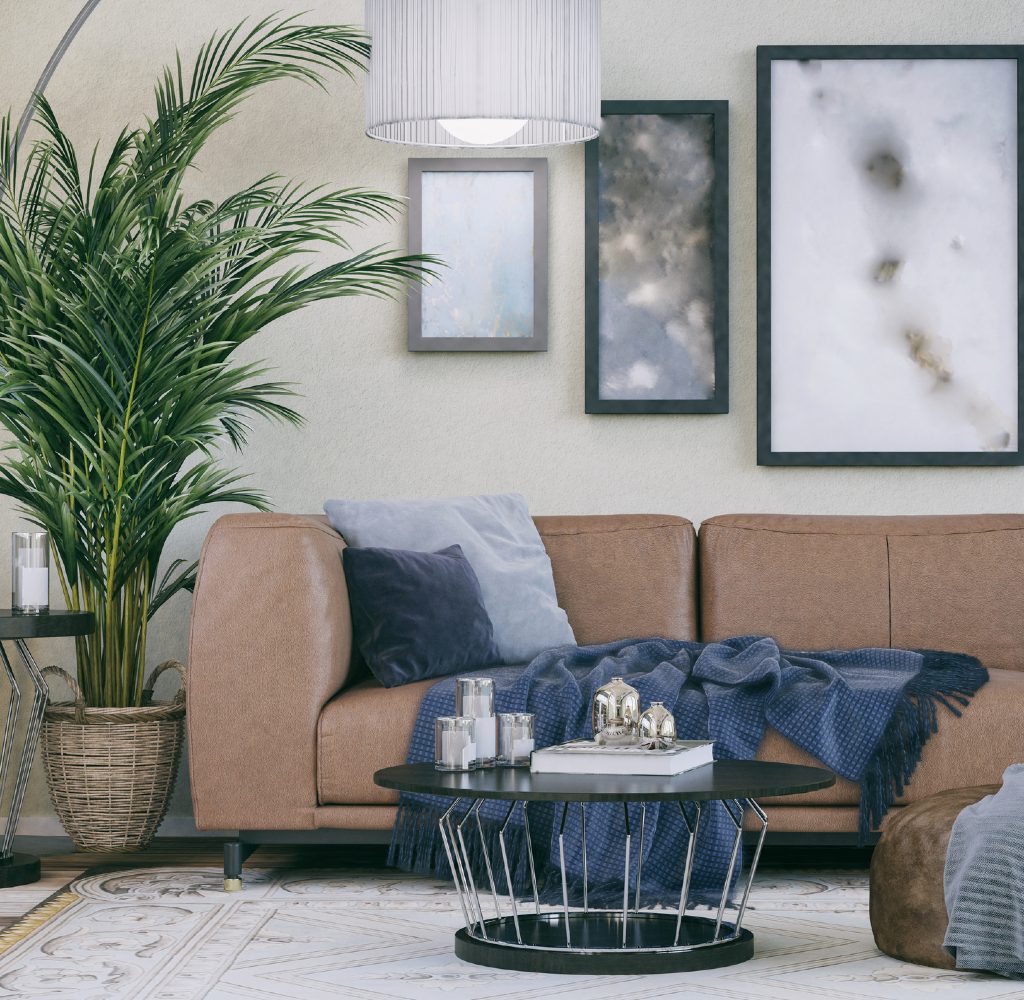 White living room with brown couch and blue accents.