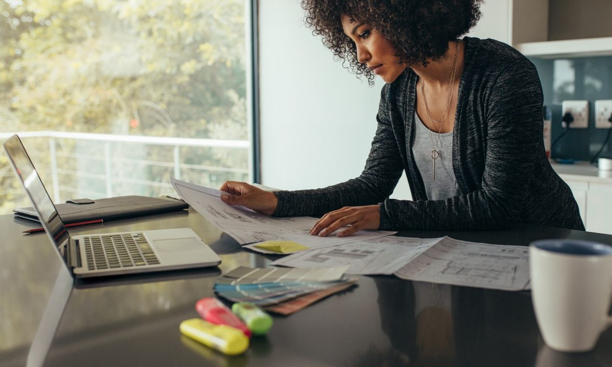 Woman sitting at desk in a work from home office