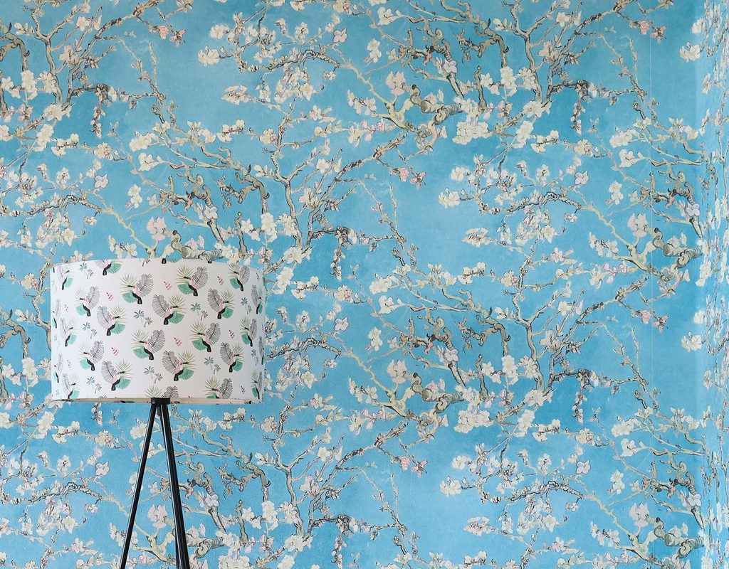 blue wallpaper with white blossoms chinoiserie style