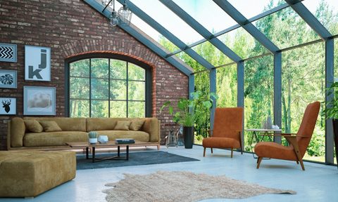 exposed red brick wall in living room with large windows