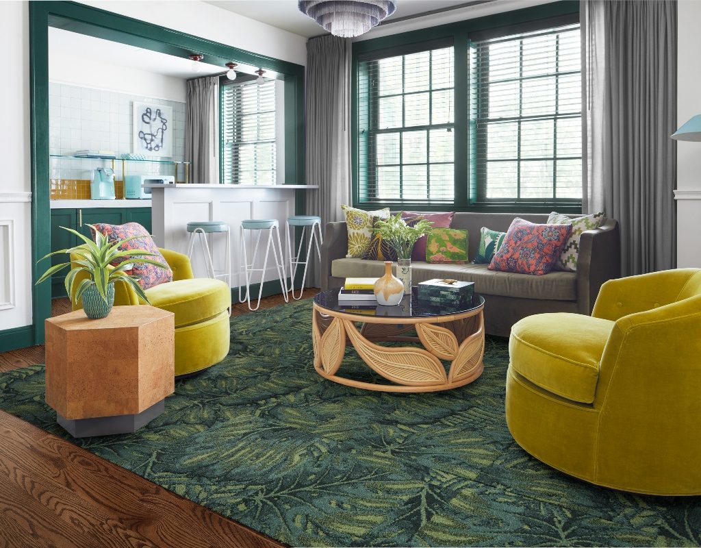 green maximalism styled room with yellow chairs by FLOR