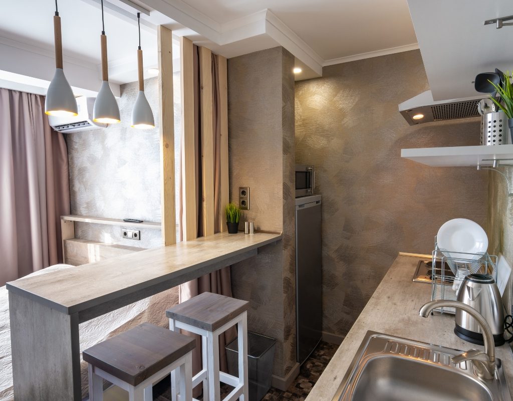 grey studio apartment with bar table divider