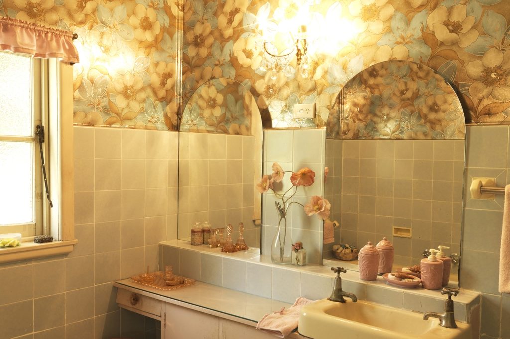 Midcentury inspired bathroom design with floral wallpaper