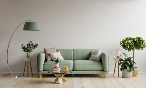 Small living room design with pastel green sofa