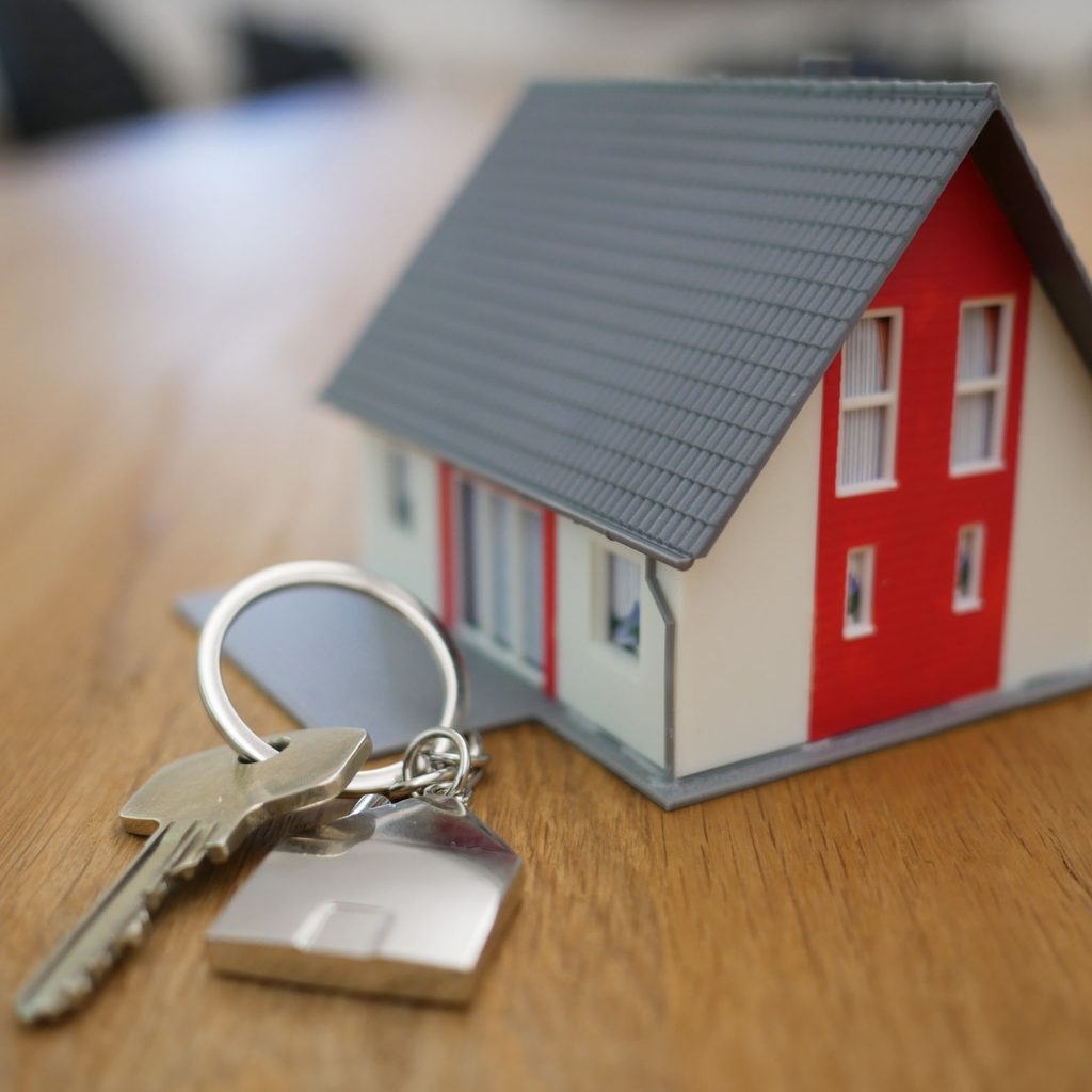 Tiny house with keys to represent buying a home