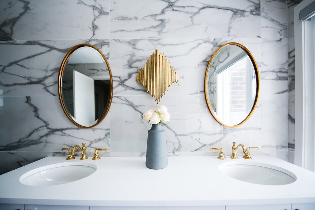 Clean bathroom sink with two mirrors