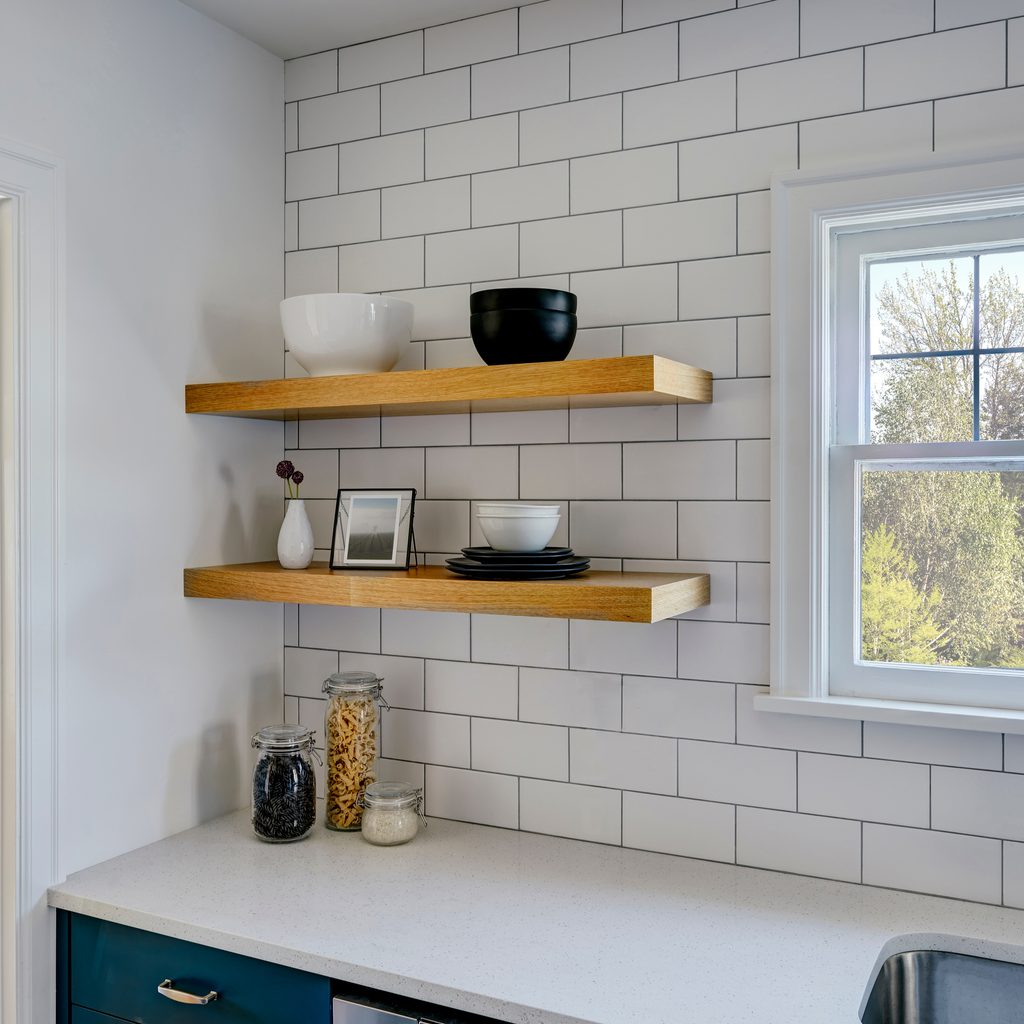 Kitchen floating shelves with matte tile backsplash