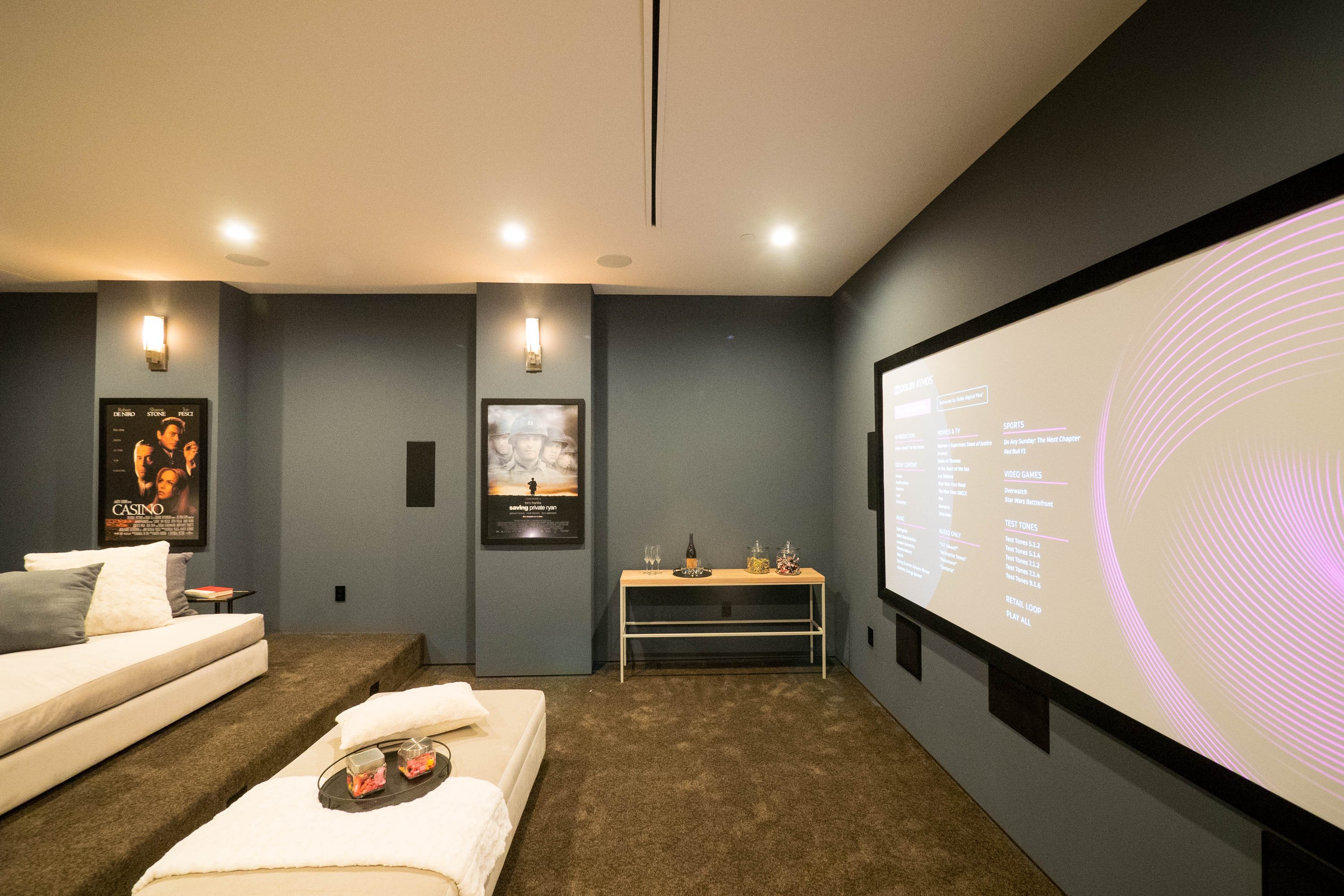 Media room basement with dark gray walls