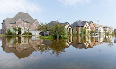 analysis of climate change risks for home buyers houses in houston suburb flooded from hurricane harvey 2017