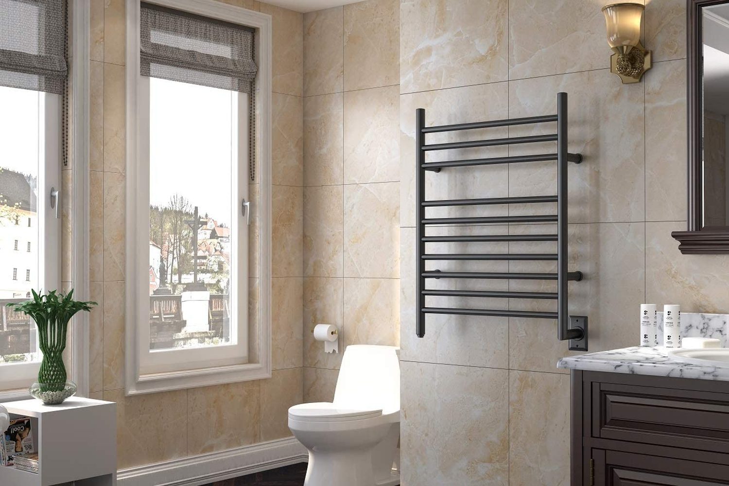 Towel warming rack on a wall in a tiled bathroom