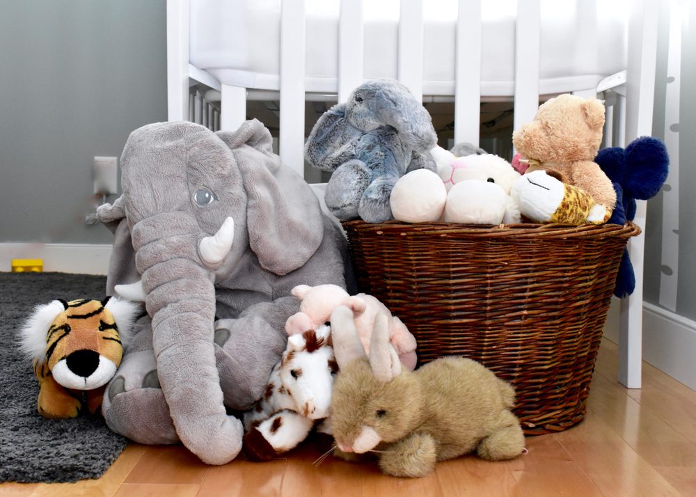 Toddler bedroom with baske of stuffed toys