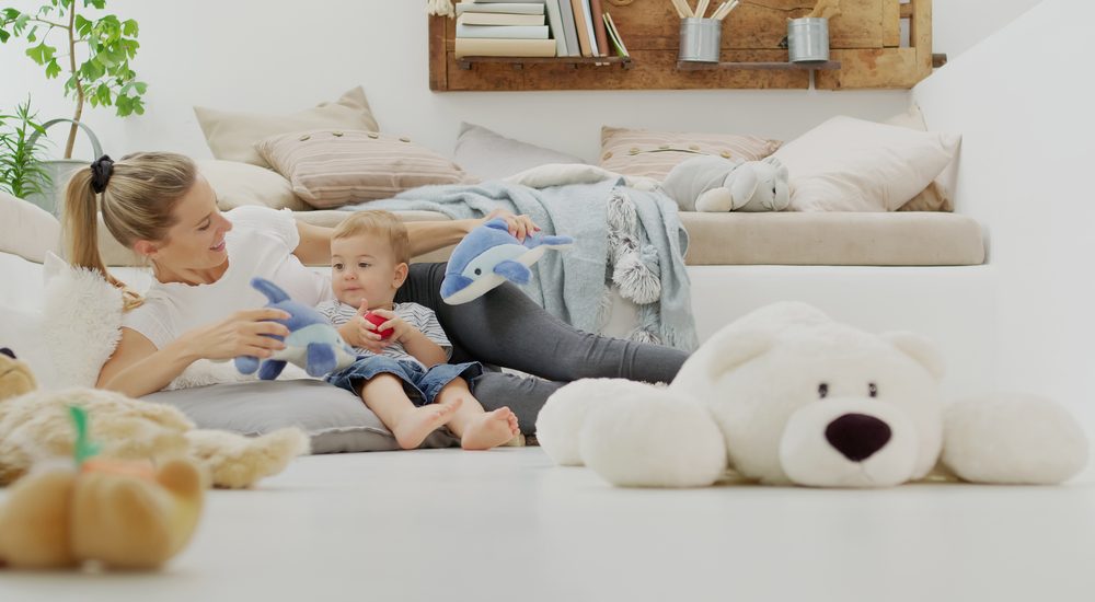 Mom and child playing with stuffed animals