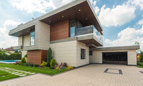 Modern house with brick driveway