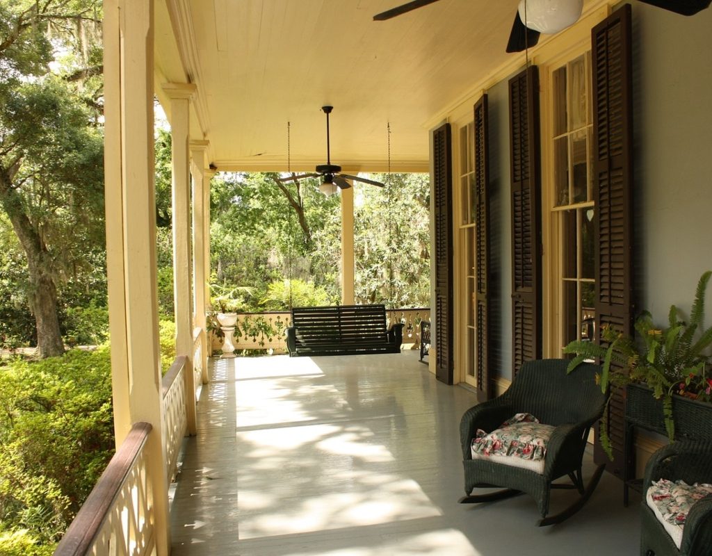 Classic Craftsman-style front porch with potted plants