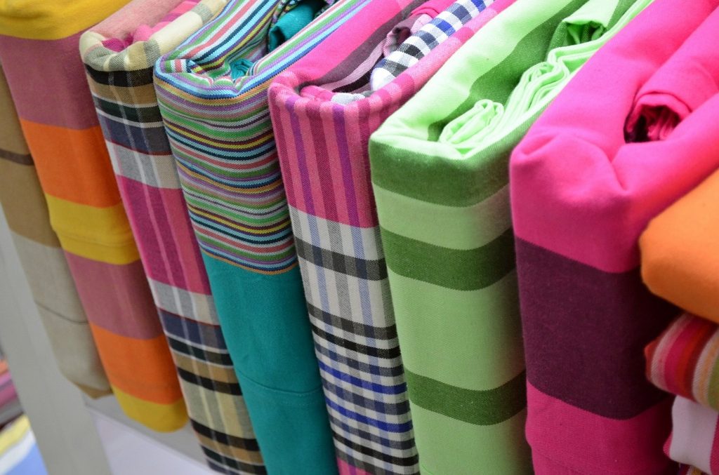 colorful bed linens neatly organized