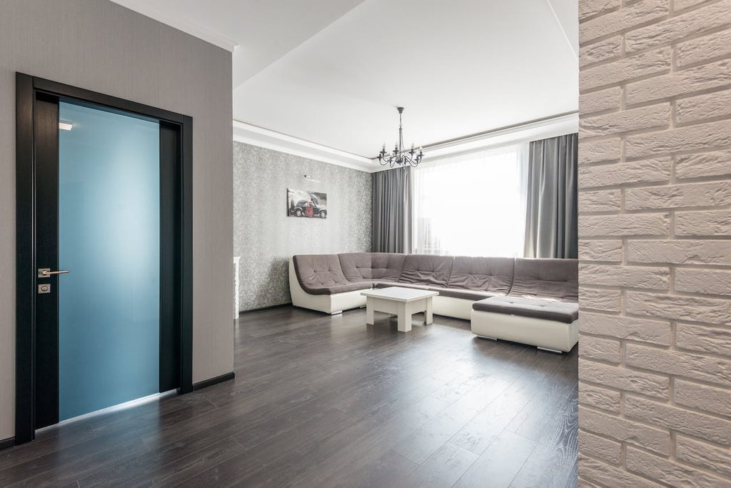 Greige living room with brick wall