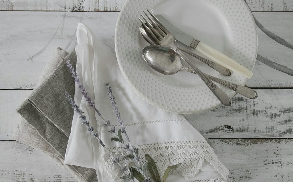 place setting on a white wood surface