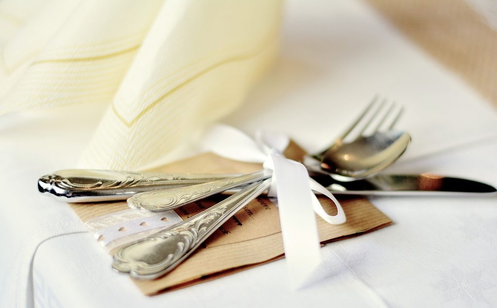 silver cutlery at an elegent place setting