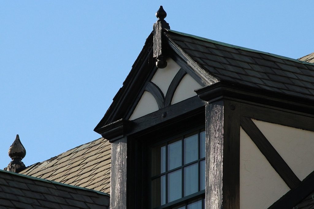 tudor style home with dormer on gables