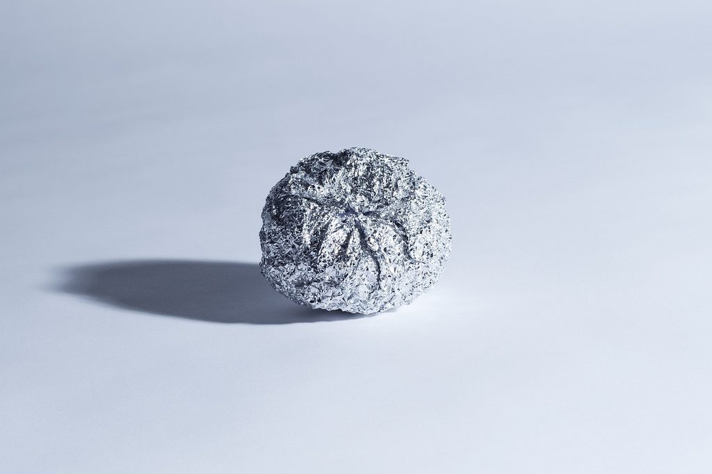 aluminum foil ball on white surface
