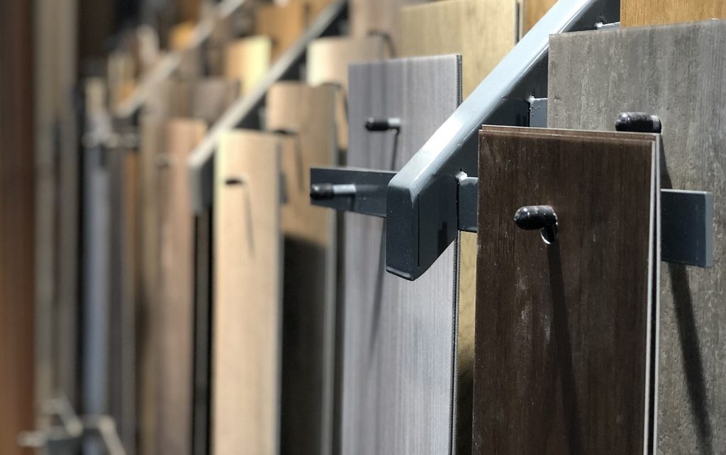 selection of parquet flooring panels hanging on pegs