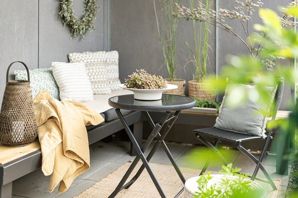 Small patio with corner seating and small round table