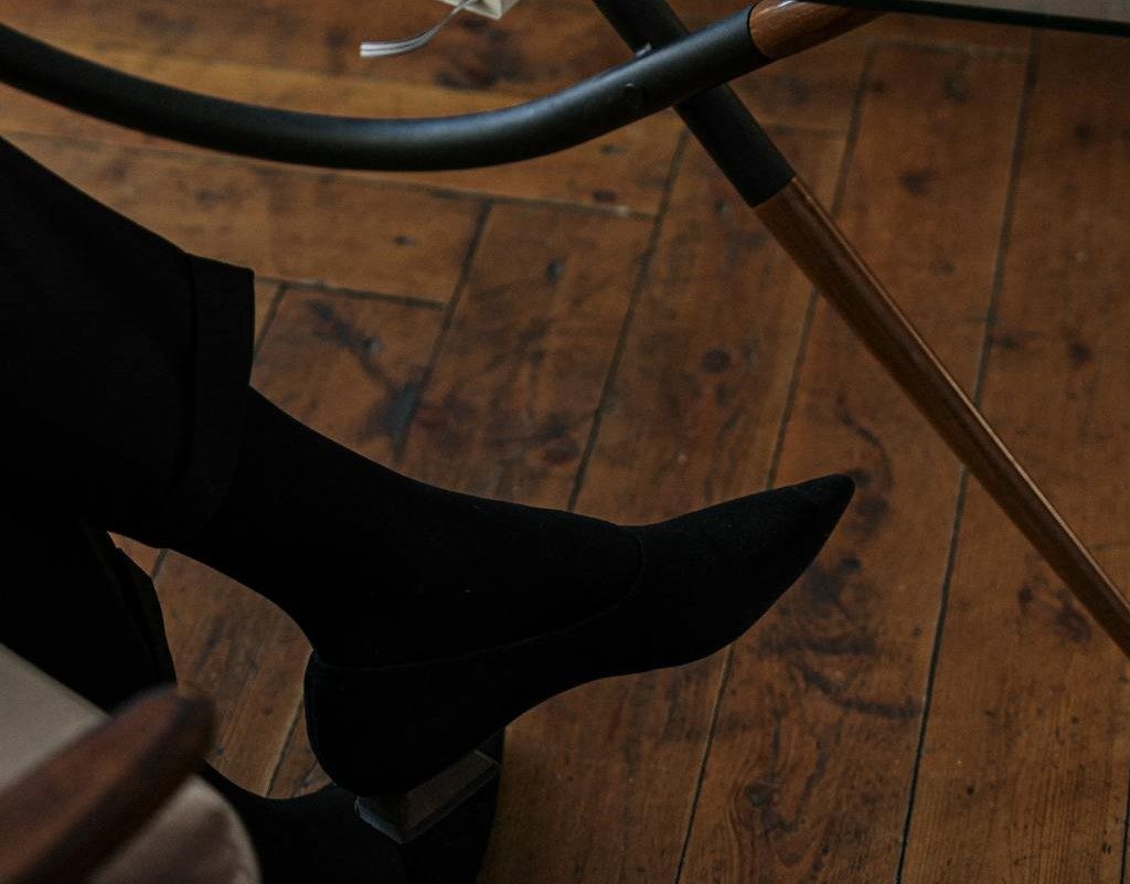 Woman's feet on parquet flooring