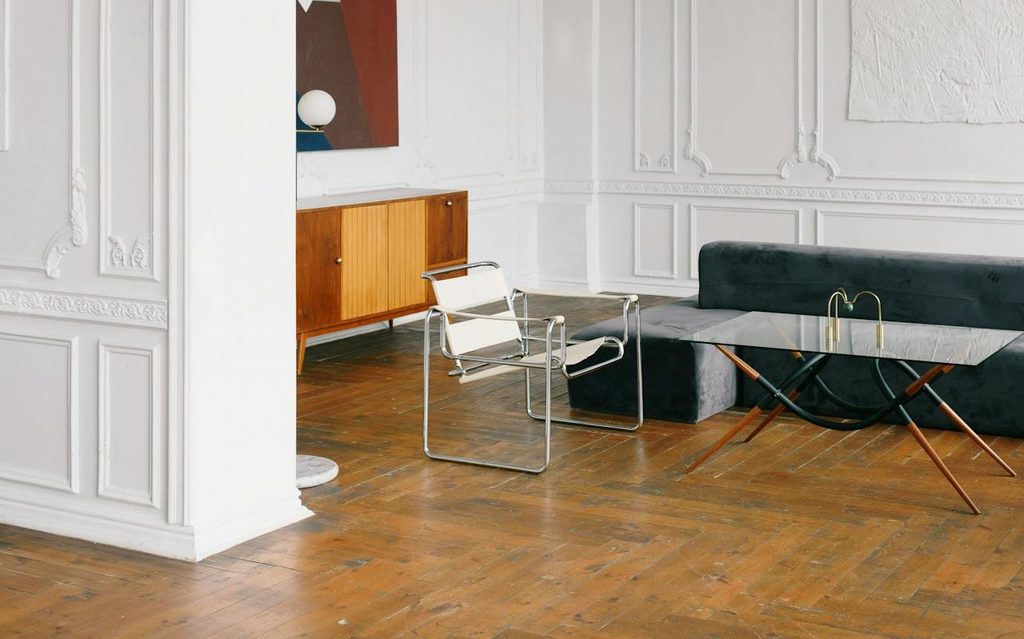 faded parquet floors in a modern, minimalist living room
