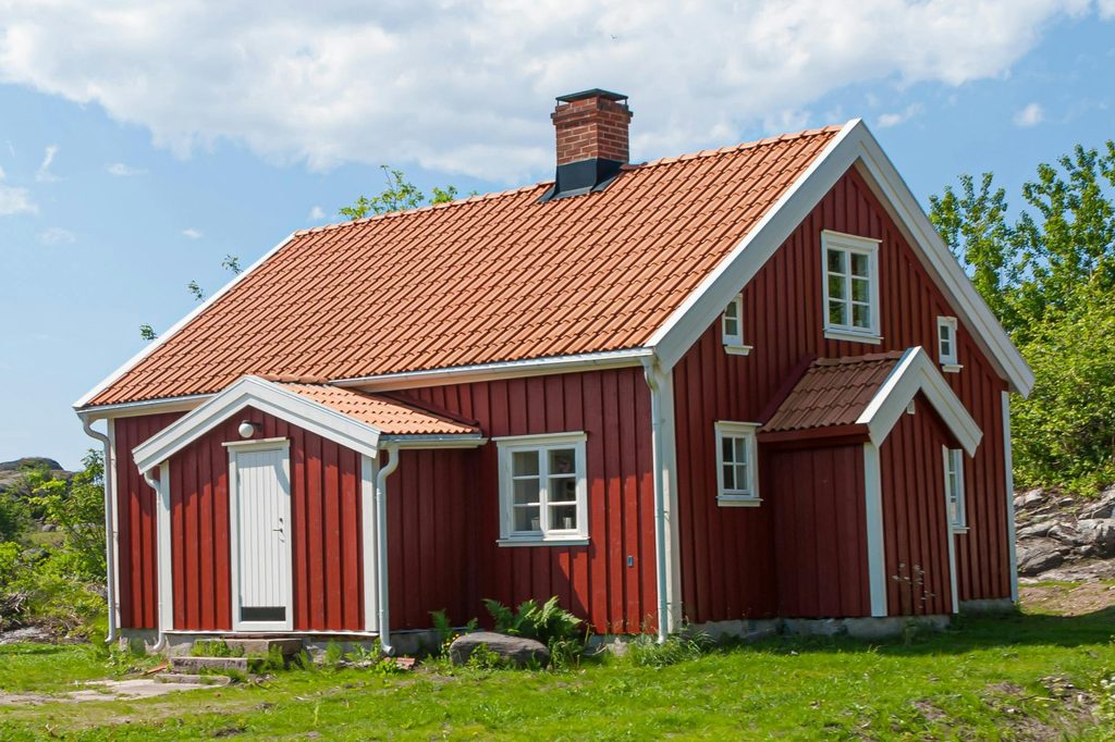 small red barn in countryside