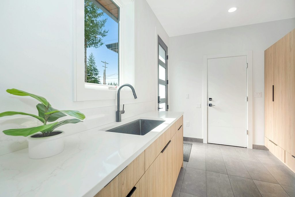 Laundry room with window and door letting light in